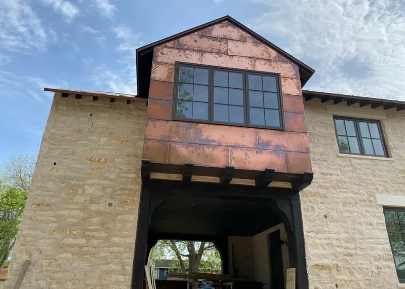 Copper metal panel facade on a stone building for Metal Roof Coating in Steger